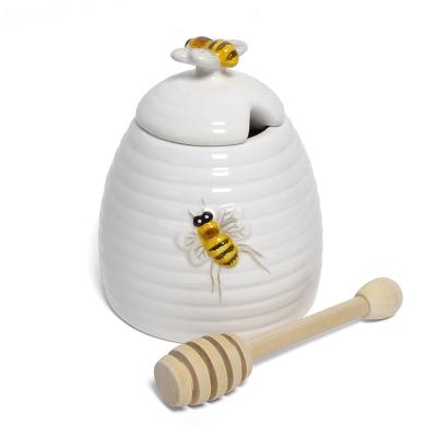 China Ceramic Honey Jar Storage Bee Design with Dipper Food Storage Jar for sale