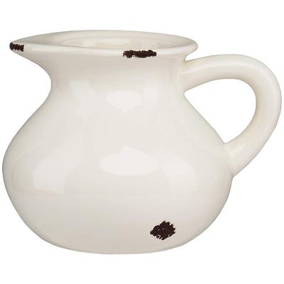 China Viable Special Design White Ceramic Water Jug With Dots Porcelain Water Pitcher for sale