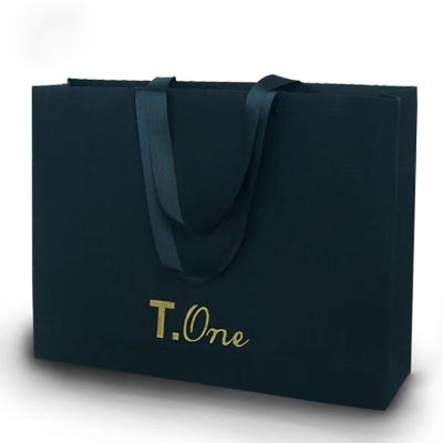 China Recycled Materials Wholesale Black Boutique Paper Gift Bag Shoes Clothes Packaging Paper Bags for sale