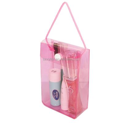 China Fashion Custom Pink Waterproof Small Colored PVC Plastic Bag Clear Cosmetic Bag With Buttons for sale