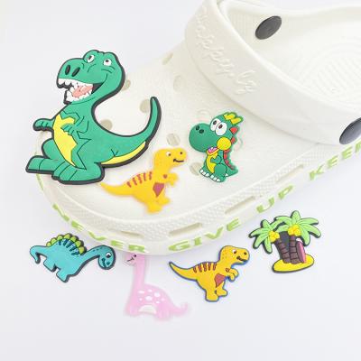 China Wholesale Custom Jurassic Hobble Charm Dinosaur PVC Shoe Accessories Shoe Charms For Fang Charms Kid Gifts for sale