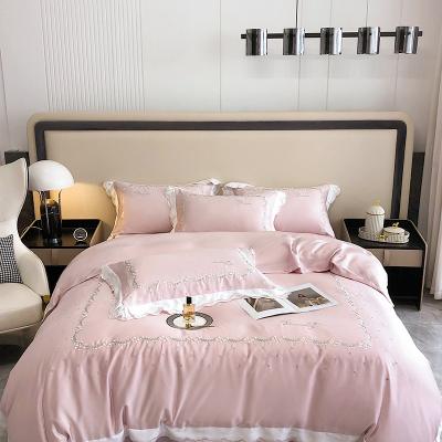 China Nondisposable Light Pink Embroidery Lyocell Fiber Bedding Set Sheet Designs With Ruffles for sale