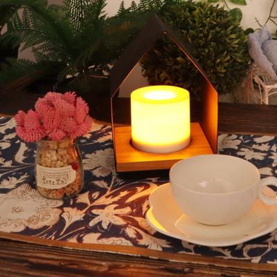 China 2022 small size home cheap black iron cottage price decoration candle table decor battery operated electronic lights shape for sale