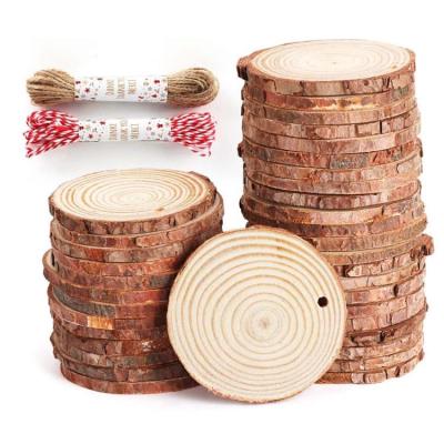 China Eco-friendly Unfinished Natural Round Disc China Pine Wood Log Tree Sliced ​​Halloween Wooden Christmas Chips For Crafts for sale