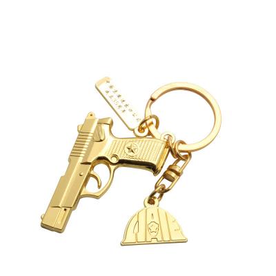 China High qualitybling metal with light rocket key chainsmetal mini gun key chains gift key chains with 3d characters for sale