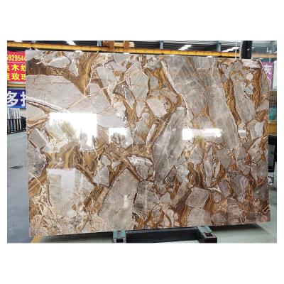 China Modern exclusive luxury gold marble stone for background and countertop for sale