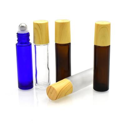 China Personal Care Free Sample 10ml Roll On Glass Bottles With Metal Trackball For Perfume Lip Balm In Stock for sale