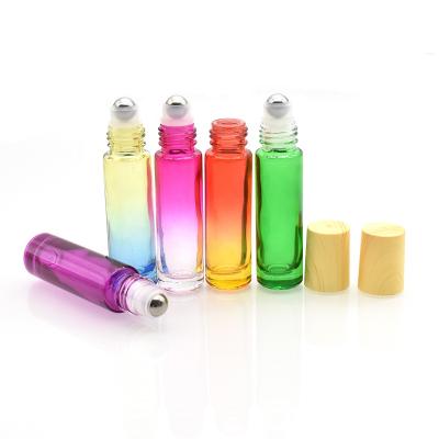 China Personal Care Empty Glass Roll On Bottle 10ml With Decoration Wooden Cap For Cosmetic Perfume In Stock for sale