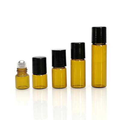 China 1ml 2ml 3ml 5ml Personal Care Glass Perfume Oil Eye Cream Amber Blue Clear Roll On Bottle With Trackball for sale