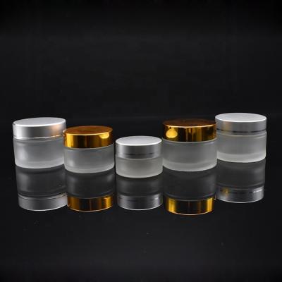 China 5g cosmetic empty 10g 15g 30g frosted glass jar 50g 100g glass cosmetic jar with gold silver aluminum cap for sale