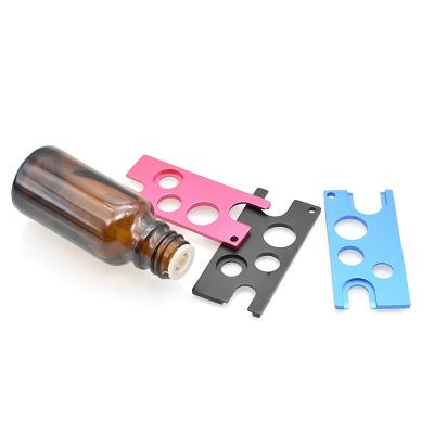 China Essential Oil Bottle Opener Glass Stock Roll Cap Stainless Steel Bottle Easier Open Key On Bottle Metal Key for sale