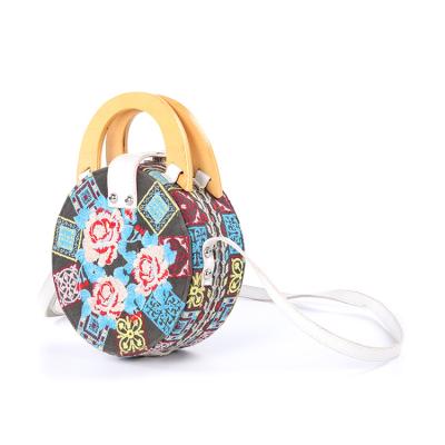 China Newspaper used cheap bags fashion small round embroidery circle purse order handbag shoulder bag for sale