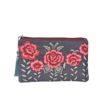 China Newspaper used embroidery flower best selling casual clutch bag for woman handbag boho clutch bag for sale