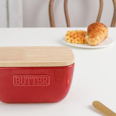 China Sustainable Custom Logo Color Ceramic Butter Dish With Wooden Lid Cheese Butter Keeper For Storage for sale