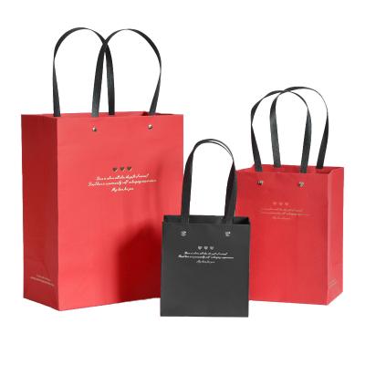 China New Design Recyclable Wholesale Custom Logo Printing Brown Kraft Paper Shopping Bag With Handle for sale