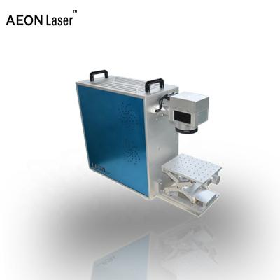 China Mini Laser Fiber Laser Marking Machine Metal Laser Marking Engraving Machine For Jewelry Home Laser Engraver à venda