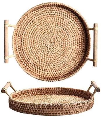 China Sustainable Hand - Woven Rattan Round Serving Tray With Handles Bread Cake Pastry Basket for sale