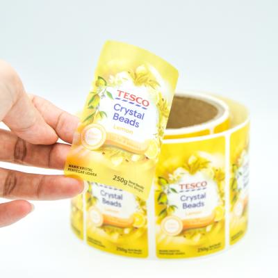 China Waterproof Custom Printing Roll Logo Gold Foil Hot Stamping Adhesive Clear Stickers Packaging Label Roll for sale