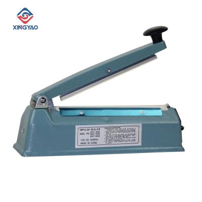 China 300W Food Hand Press Sealing Machine PFS-200T Iron Cover Pulse Hand Sealer Equipment For Household Use for sale