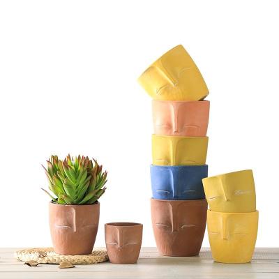 China Low MOQ Modern Macetas Para Plantas 3.3/4.4/5.3 inch Clay Flower Pot Ceramic Human Small Colored Face Pot Planter for sale