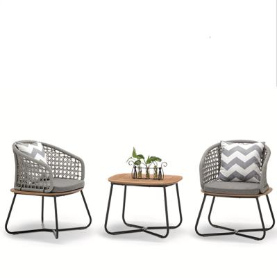 China Futuristic Luxury UV Proof Hand-woven Farmhouse Tempered Glass Rope Cafe Chair Garden Waterproof Cafe Set for sale