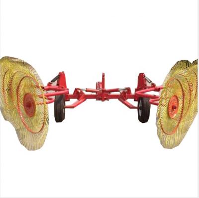 China Factory PTO Wheel Driven Hay Rake 3 Point Finger for sale