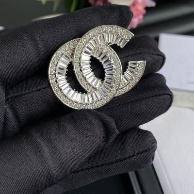 China Europe and America colored women designer brooches and pins luxury high quality silver pins for sale