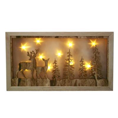 China Wooden environmental friendly Christmas shadowbox with reindeer and tree decoration with LED lighting for sale