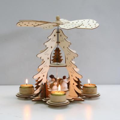 China Environmental friendly Christmas wooden pyramid with hand painted nativity figurines with spinning wings with 3 candle holders for sale