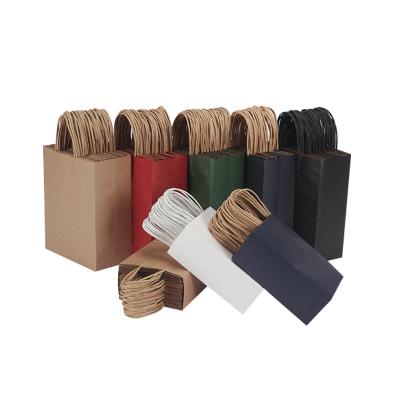 China Recycled Materials Custom Printed Craft Paper Shopping Paper Bag With Your Own Logo for sale