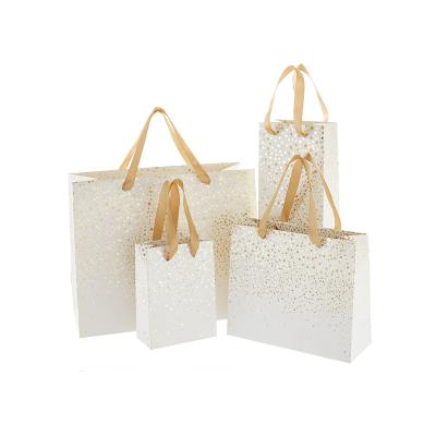 China Recyclable Luxury Fancy Custom Paper Bag With Logo Stand Up Wedding Favor Gift Packaging Bags for sale