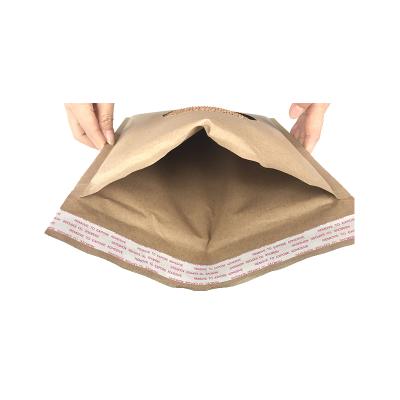 China Custom Recyclable Strong Adhesive Glue Clothing Paper Bag Factory Wholesale Express Kraft Paper Envelope Filled Packaging Bags for sale