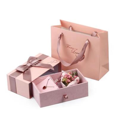 China Custom Recycled Materials Logo Jewelry Packaging Earring Necklace Bracelet Luxury Cardboard Box With Pink Paper Bag for sale