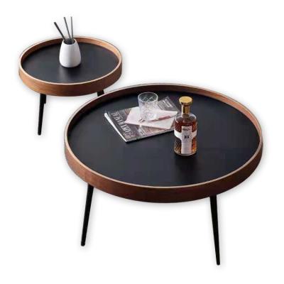 China Good Quality Extendable Nordic Contemporary Living Room Modern Metal Black Legs Around Black Wooden Interlocking Top Coffee Table for sale