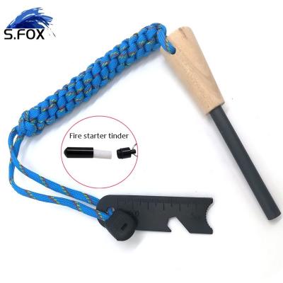 China Durable Most Popular Paracchute Handle Survival Flint Rod Fire Starter With Free Braided Wooden Flammable Material for sale