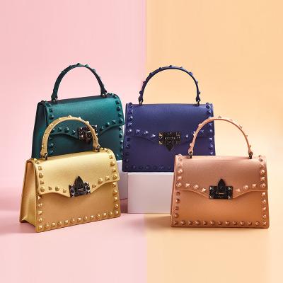 China 2021 new fashion jelly lady bag summer pvc diamond color mobile phone handbags rivet single shoulder diagonal bag for sale