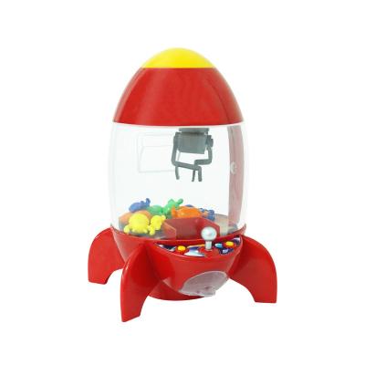 China Cartoon Toys Rocket Simulator Clockwork Game Machine Coin Operated Kids Toy Catcher Alarm Mini Dolls Grabber Machine Cartoon Desktop Toys Plastic for sale