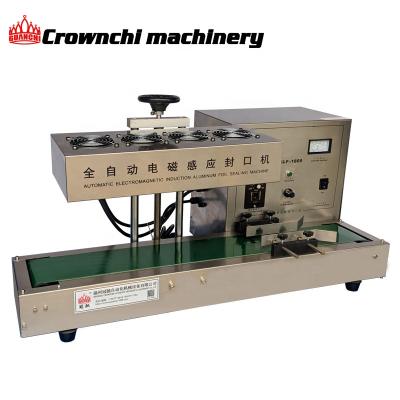 China Food Table Top Automatic Bottle Lid Magnetic Induction Aluminum Sealing Machine for sale