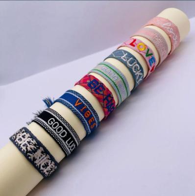 China Handmade Jewelry Adjustable Woven Letter Embroidered Letter Hand Woven Rope for sale