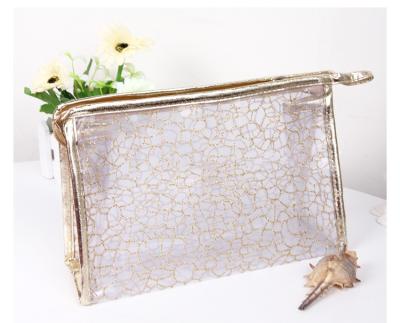 China Custom Clear Wash Toiletry Bag Travel Makeup PVC Hollowed Transparent Portable Logo Cosmetic Bag for sale