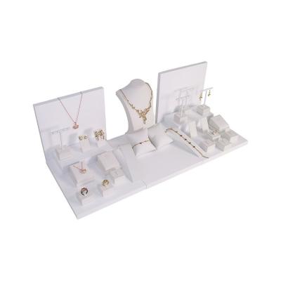 China Beautiful 2022 New Design White PU Leather Jewelry Display Coated With MDF Jewelry Rack Display Set for sale