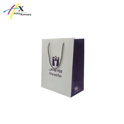 China Recycled Materials Premium Printed Shopping Bags Custom Gift Bag With Logo for sale