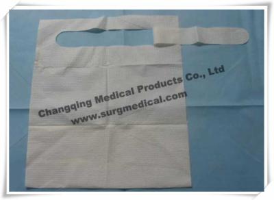 China Waterproof Dental Bibs 3 Layer / Disposable Paper Bibs With Pocket for sale