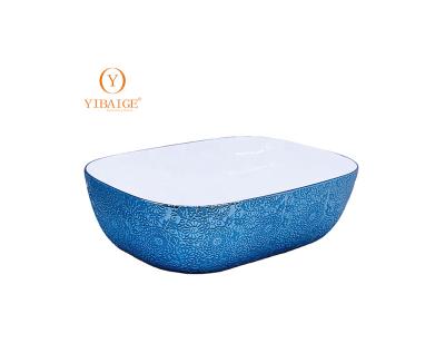 China Modern Fancy Luxury Embossed Pattern Design Hotel design OEM blue design electroplating gold color ceramic sanitary ware art basin for sale