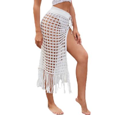 China Women Plus Size Beachwear Cover Up Solid Crochet Hollow Out Tassel Swimsuit Beach Bikini Knit Skirt for sale