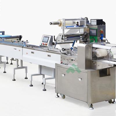 China Full Automatic Food Pillow Bag Tray Biscuit Bakery Product Packing Line Feeder Machine For Flowing Package for sale