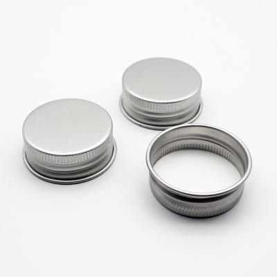 China Non Refillable Aluminum Screw Caps Bottle Jar Caps With Plastic Liner Stamping Bottle Lids for sale