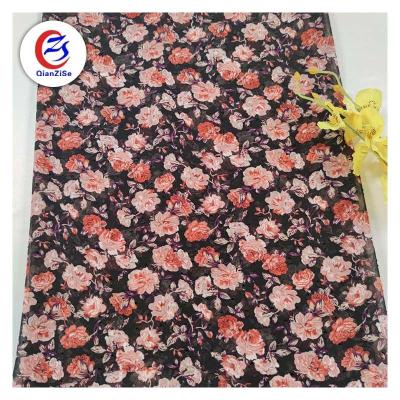 China Modern feeling design flower print jacquard dot uragri silk chiffon fabric for lady dress for sale