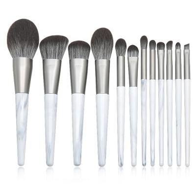 China Angular Blush Pattern Wooden Handle Makeup Brush Set Professional 12 Tapered Eye and Marble Makeup Brush Ink Synthetic Fiber High Quality New for sale