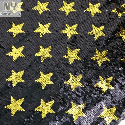 China Nanyee Breathable Textile 5mm Fish Scales Gold Black Ground Star Sequin Reversible Fabric for sale